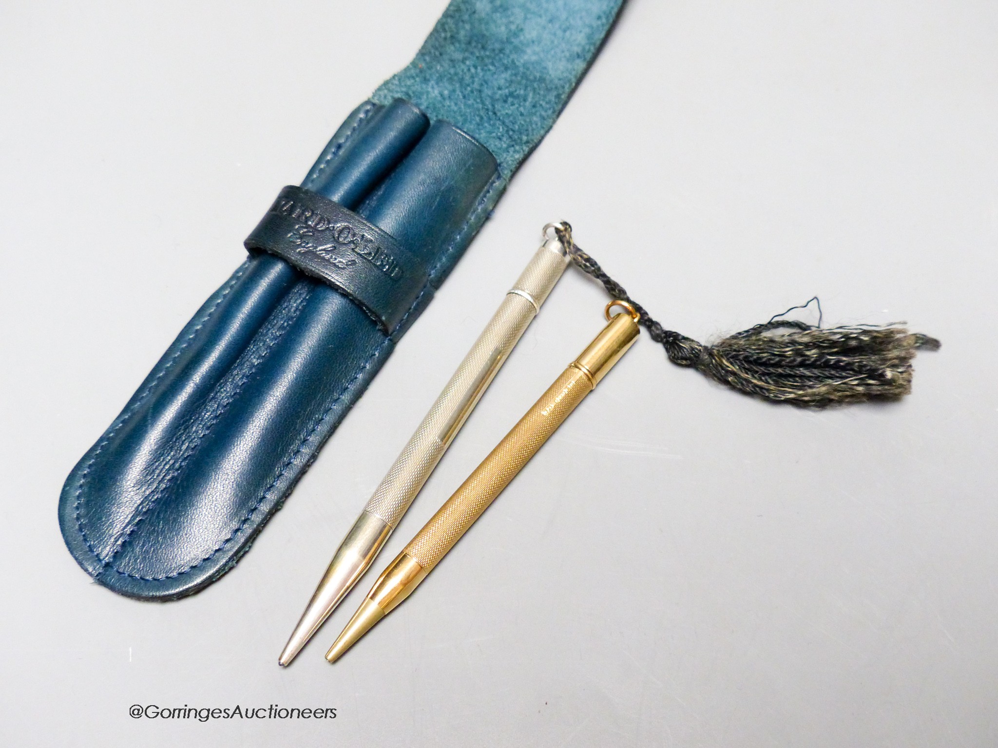 A 9ct gold propelling pencil and a Hukin and Heath silver propelling pencil